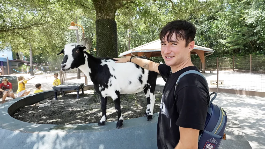 Ryan Martel petting goat at Disney's Animal Kingdom
