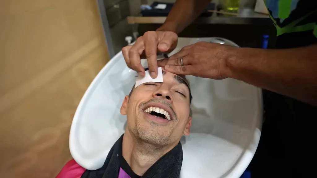 JoJo Crichton getting his eyebrows waxed