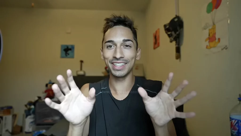 JoJo Crichton showing that his hands are shaking in response to being criticized