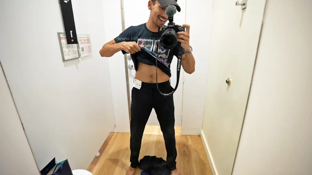 JoJo Crichton trying on pants in the dressing room