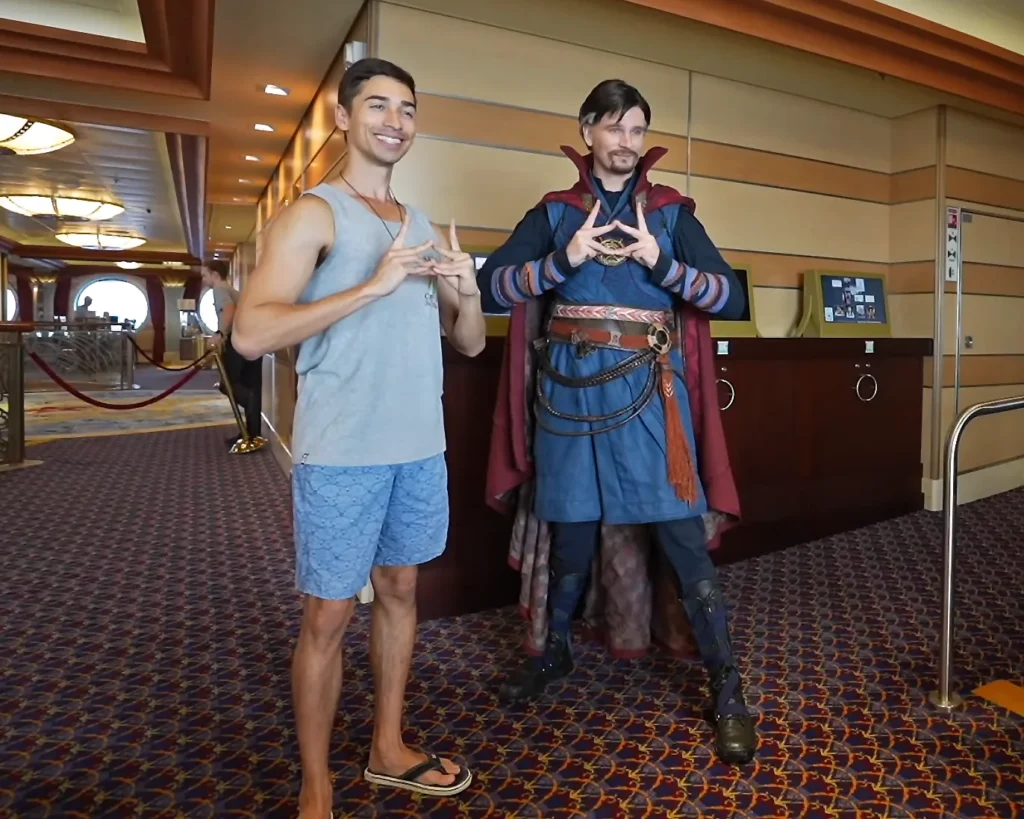 JoJo Crichton posing with Doctor Strange during Marvel Day at Sea on the Disney Dream